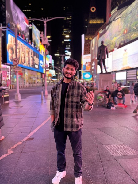 Times Square at night, under the billboards